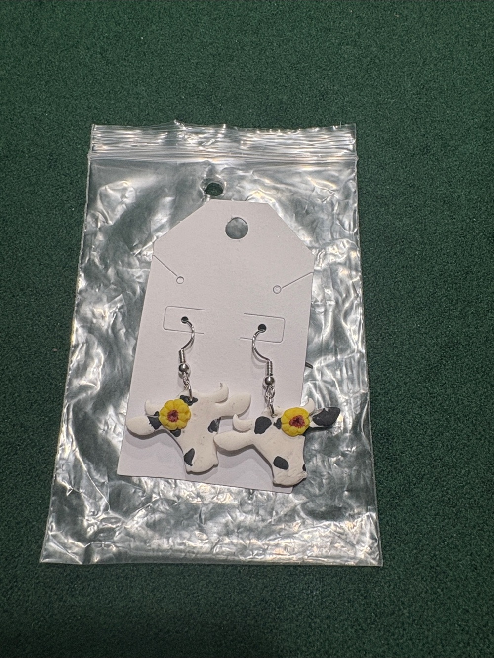 Handmade White Cow Print Women’s Clay Earrings with Yellow Flower Accent